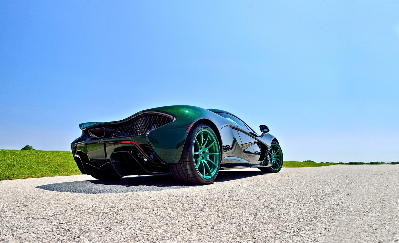 Green super car on the road