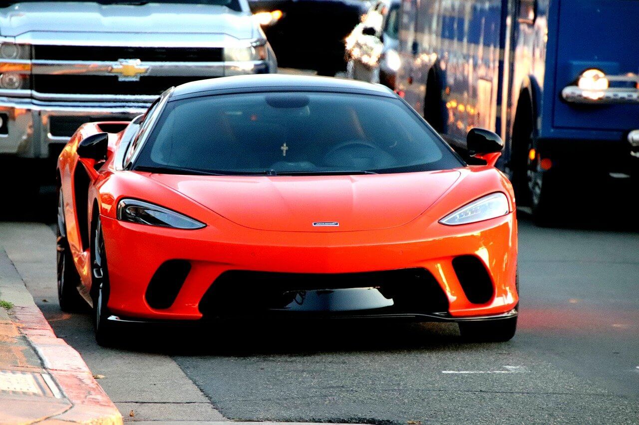 Orange maclaran parked on the road