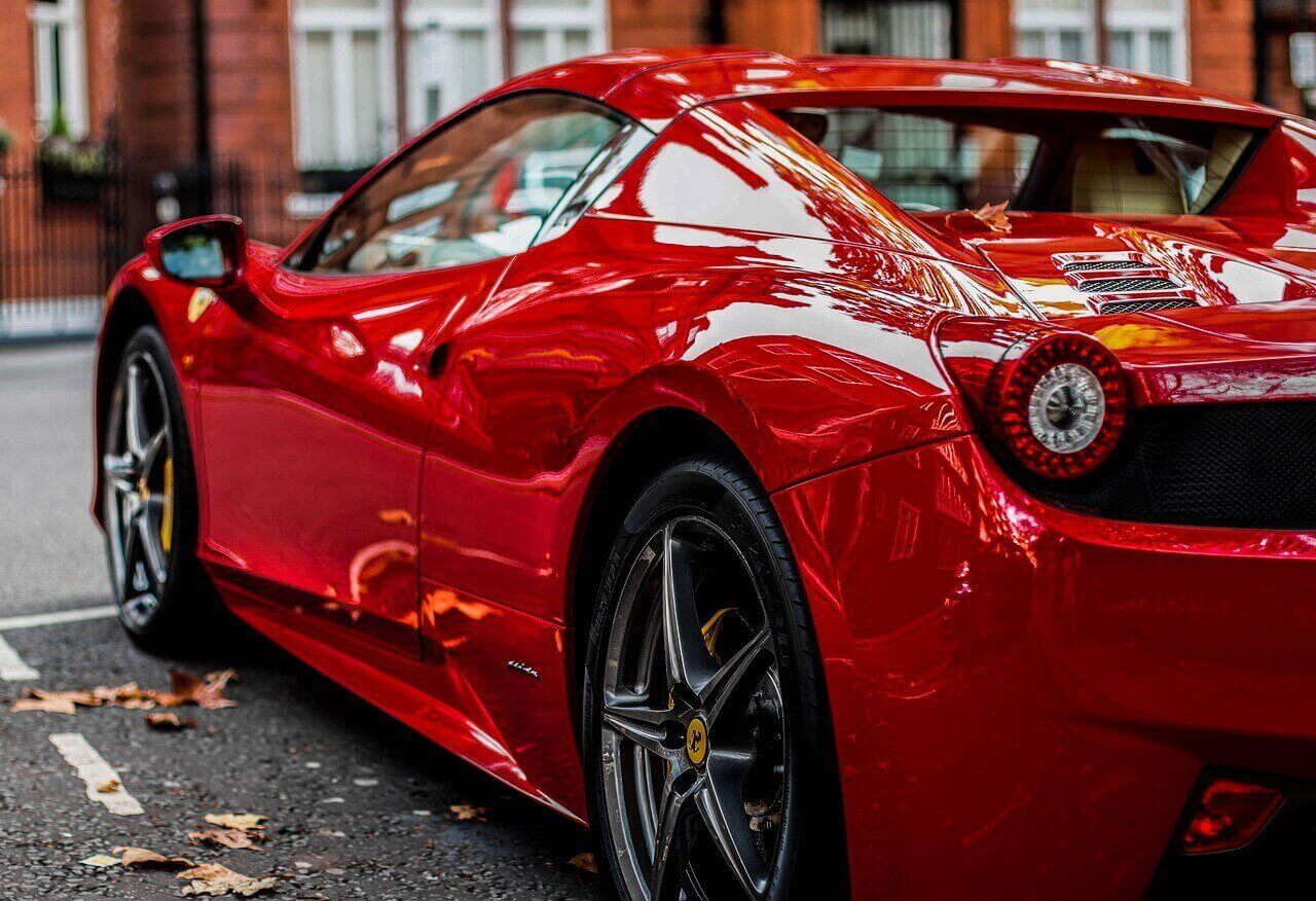 Red Ferrari Spider parked