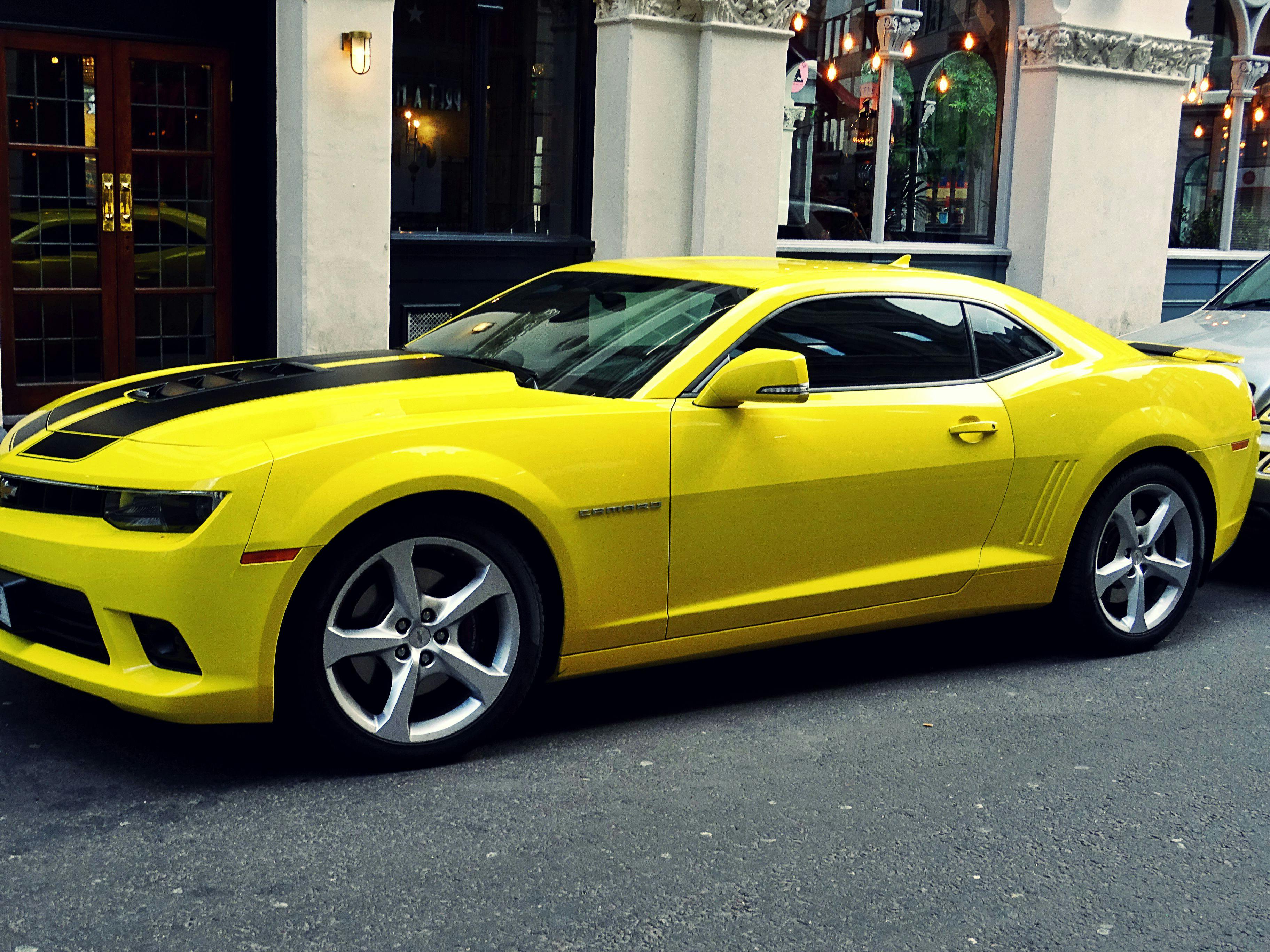 yellow car chevrolet camaro