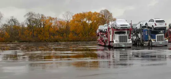 an open trailer with loaded cars