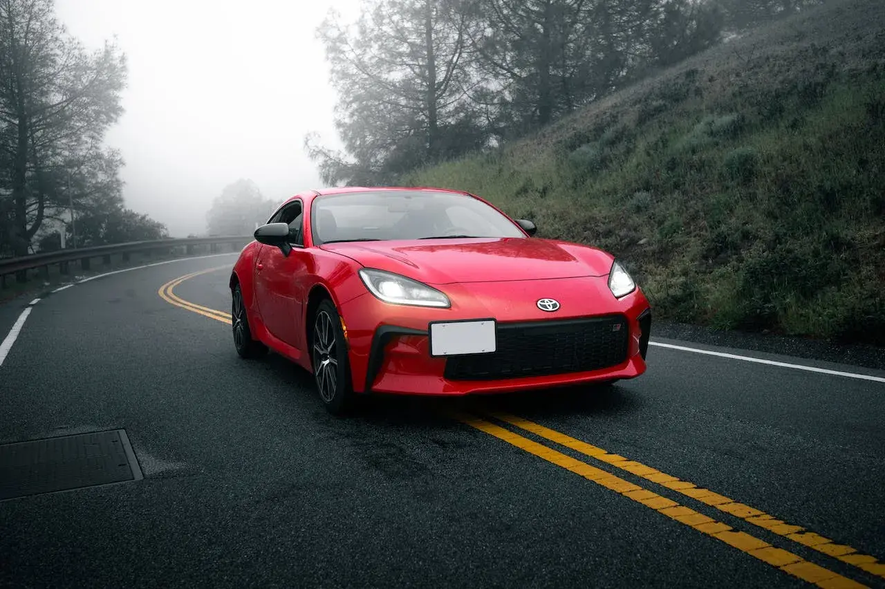 Red Toyota Camry on the road