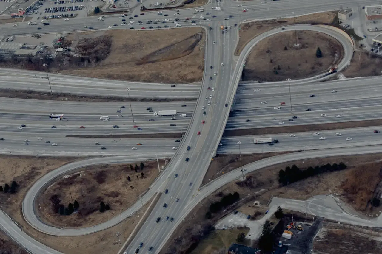 Cars driving on asphalt winding road of freeway