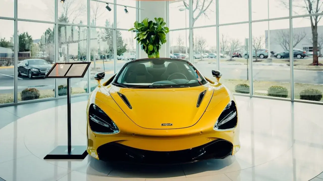 A luxury car in a dealership building