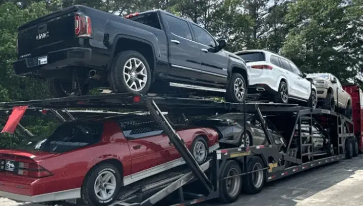 Open car trailer loaded with cars
