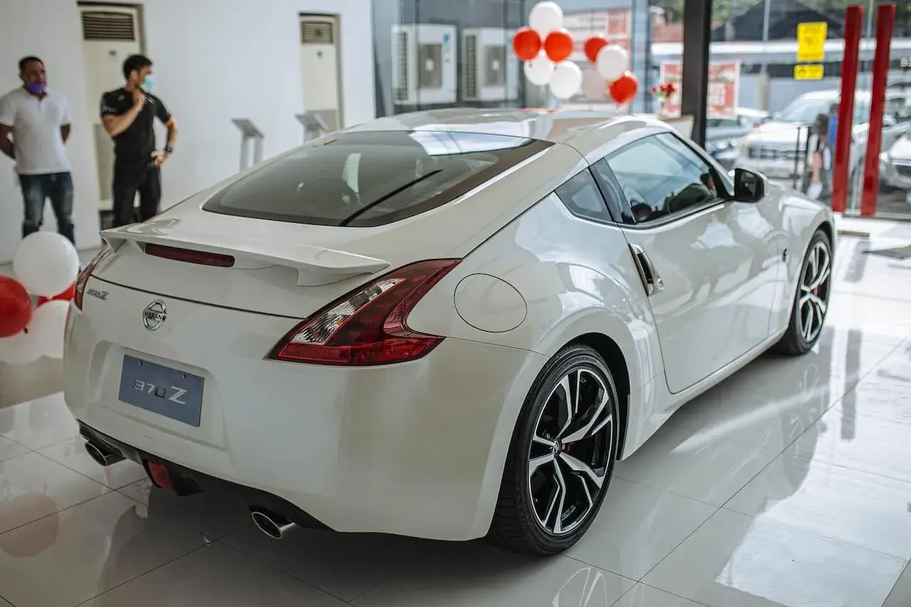 White car parked in a dealership store